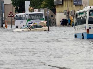 A car was stuck in a flooded tunnel and nearly submerged in water. (Twitter)