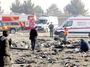 Rescue teams go through the debris after a Ukrainian plane carrying 176 passengers crashed in Tehran yesterday, killing all on board. Photo/AFP