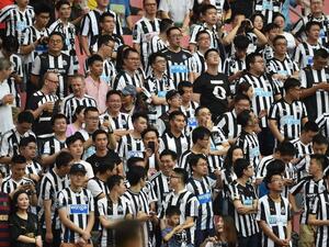 Newcastle United fans look on during their match for third place against West Ham United in the 2019 Premier League Asia Trophy football tournament at the Hongkou Stadium in Shanghai on July 20, 2019. HECTOR RETAMAL / AFP