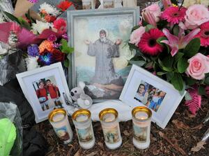 Flowers and images of those involved in the accident are pictured at a makeshift memorial at the site of an accident which killed four children the day before, in the Oatlands suburbs of Sydney on February 2, 2020. Farooq KHAN / AFP