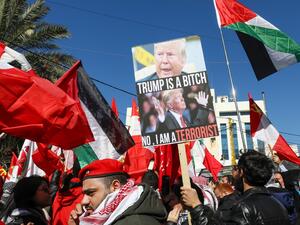 Demonstrators wave the Palestinian flag and leftist flags during a demonstration against the US peace plan proposal, near the US embassy in Awkar, northeast of the capital Beirut on February 2, 2020. ANWAR AMRO / AFP