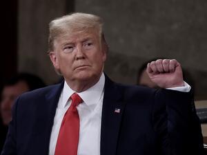 President Donald Trump pumps his fist as he delivers the State of the Union address in the chamber of the US House of Representatives at the US Capitol Building on February 4, 2020 in Washington, DC. Olivier DOULIERY / AFP
