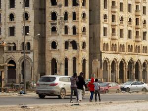 Libyans walk in the eastern Libyan port city of Benghazi on February 13, 2020. Abdullah DOMA / AFP