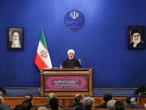 Iranian President Hassan Rouhani speaks during a news conference in the capital Tehran, on February 16, 2020, with the portraits of Iran's (L to R) former and current Supreme Leaders, Ayatollah Ruhollah Khomeini and Ayatollah Ali Khamenei, seen behind. AFP