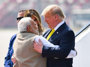India's Prime Minister Narendra Modi (L) embraces US President Donald Trump upon his arrival at Sardar Vallabhbhai Patel International Airport in Ahmedabad on February 24, 2020. MANDEL NGAN / AFP