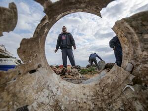 Palestinians salvage belongings from the site of an Israeli airstrike east of Khan Yunis in the southern Gaza Strip, on February 25, 2020. AFP