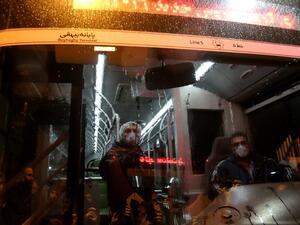 A Tehran Municipality worker cleans a bus to avoid the spread of the COVID-19 illness on February 26, 2020. Iran said Tuesday its coronavirus outbreak, the deadliest outside China, had claimed 15 lives and infected nearly 100 others -- including the country's deputy health minister. The Islamic republic's neighbours have imposed travel restrictions and strict quarantine measures after reporting their first cases in recent days, mostly in people with links to Iran. ATTA KENARE / AFP