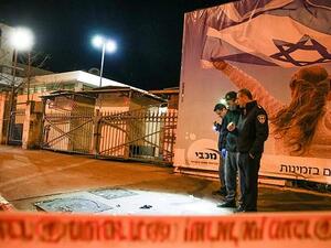 Israeli policemen inspect the site of a car-ramming attack carried out by a Palestinian in Jerusalem in the early hours of this morning  (AFP)
