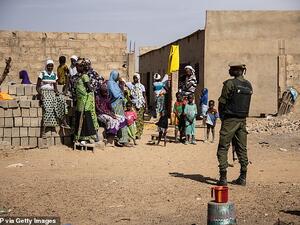 A Burkina Faso soldier patrols at a district that welcomes Internally Displaced People (IDP) from northern Burkina Faso, in Dori on February 3, 2020. (AFP)