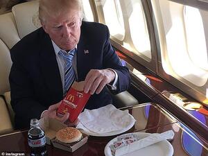President Trump sings the praises of fast food; he's seen here eating a McDonald's hamburger during the 2016 presidential campaign. (Instagram)