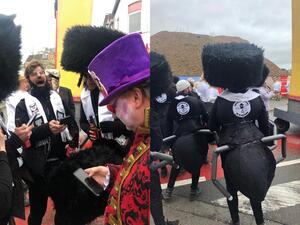 Participants of the Aalst Carnival wearing costumes combining ultra-Orthodox Jewish attire with ant limbs at the event in Aalst, Belgium on February 23, 2020. (Cnaan Liphshiz/ Twitter/ @RaphaelAhren)