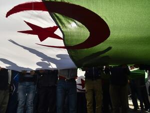 Algerian demonstrators wave the national flag during a demonstration in the capital Algiers, on February 28, 2020. Mass protests erupted in Algeria a year ago last Saturday, in response to President Abdelaziz Bouteflika announcing he intended to run for a fifth term after 20 years in power -- despite being debilitated by a 2013 stroke. RYAD KRAMDI / AFP