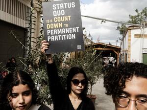 Cypriot demonstrators gather in the the United Nations Buffer Zone during a protest against the closure of checkpoints at the Ledra Street checkpoint in the divided capital of Nicosia on February 29, 2020. Cyprus announced the temporary closure of half of the crossing points across the divided island's ceasefire line in an effort to prevent a coronavirus outbreak. Four of the eight checkpoints will be shut for seven days "for more effective control over the entry points," said health minister Constantinos I