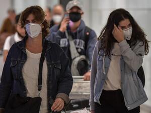 Passengers wearing masks as a precautionary measure to avoid contracting the new coronavirus, COVID-19, arrive on a flight from Italy at Guarulhos International Airport, in Guarulhos, Sao Paulo, Brazil on March 2, 2020. AFP