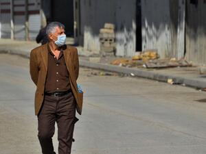 An Iraqi man wearing a protective mask walks in a deserted street in the northern Iraqi city of Mosul on March 3, 2020 amid fears of the spread of the coronavirus across Iraq. Iraq reported its first coronavirus case last week in an Iranian national studying at a religious seminary in the southern shrine city of Najaf. The total number of diagnosed infections has since jumped to 19 -- all traced to the Islamic republic, just across the border. This has sparked public panic in Iraq, one of Iran's largest export markets and a popular destination for Iranian Shiite Muslim pilgrims. Zaid AL-OBEIDI / AFP An Iraqi man wearing a protective mask walks in a deserted street in the northern Iraqi city of Mosul on March 3, 2020 amid fears of the spread of the coronavirus across Iraq. Iraq reported its first coronavirus case last week in an Iranian national studying at a religious seminary in the southern shrine city of Najaf. The total number of diagnosed infections has since jumped to 19 -- all traced to the Islamic republic, just across the border. This has sparked public panic in Iraq, one of Iran's largest exp