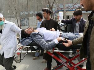 An injured man is brought on a stretcher to an ambulance following a gun attack during an event to mark the 25th anniversary of death of Shiite leader Abdul Ali Mazari, In Kabul on March 6, 2020. At least 27 people were killed in an attack on a political rally in Kabul on March 6, officials said, in the deadliest assault in Afghanistan since the US signed a withdrawal deal with the Taliban. STR / AFP