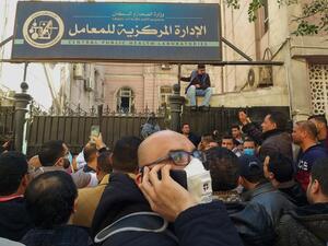 Egyptians bound for GCC countries gather in front of the Central Public Health Laboratories in downtown Cairo as they wait to get tested for coronavirus (COVID-19) on March 8, 2020. Khaled DESOUKI / AFP