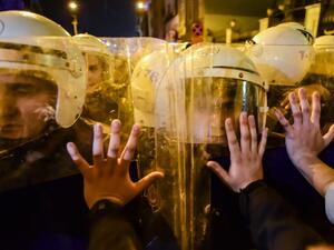 Turkish anti-riot police officers push back women during a rally marking International Women's Day on Istiklal avenue in Istanbul on March 8, 2020. Istanbul police fired tear gas at thousands of women who took to the city's central avenue on International Women's Day on March 8 in defiance of a protest ban to demand greater rights and denounce violence. Yasin AKGUL / AFP