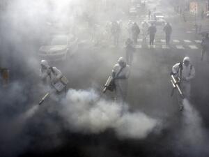 Iranian Firefighters disinfect streets in the capital Tehran in a bid to halt the wild spread of coronavirus on March 13 2020. Iranian forces will clear the streets nationwide within 24 hours and all citizens will be checked for the new coronavirus in a bid to halt its spread, the military said. AFP