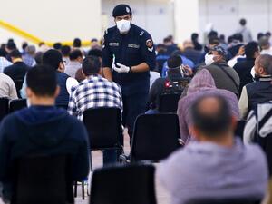 Expatriate returning from Egypt, Syria, and Lebanon arrive to be re-tested at a Kuwaiti health ministry containment and screening zone for COVID-19 coronavirus disease in Kuwait City on March 16, 2020. AFP/File