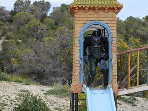A health worker disinfects the Enahli amusement park on March 16, 2020 at Ariana near Tunis, which has been closed to the public from today during the coronavirus COVID-19 pandemic. A decision was made today by the authorities to ban parties, parks, weekly souks and all sporting activities. FETHI BELAID / AFP A health worker disinfects the Enahli amusement park on March 16, 2020 at Ariana near Tunis, which has been closed to the public from today during the coronavirus COVID-19 pandemic. A decision was made today by the authorities to ban parties, parks, weekly souks and all sporting activities. FETHI BELAID / AFP