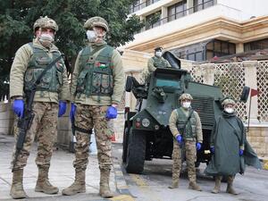 Jordanian soldiers keep watch on March 18, 2020 in the capital Amman as Jordan takes measures to fight the spread of the coronavirus COVID-19. Khalil MAZRAAWI / AFP Jordanian soldiers keep watch on March 18, 2020 in the capital Amman as Jordan takes measures to fight the spread of the coronavirus COVID-19. Khalil MAZRAAWI / AFP