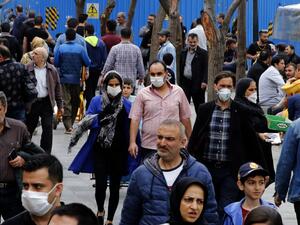 Iranians, some wearing protective masks, gather inside the capital Tehran's grand bazaar, during the Covid-19 coronavirus pandemic crises, on March 18, 2020. AFP