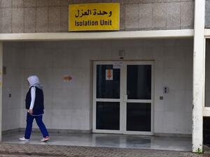 A medical worker walks past the coronavirus isolation section at Rafiq Hariri University Hospital in Beirut on March 20, 2020 where coronavirus COVID-19 patients are being treated. AFP
