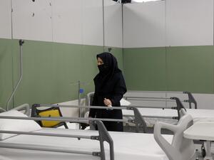 An Iranian health inspector checks a makeshift hospital set up inside the Iran Mall, northwest of Tehran, on March 21, 2020 amid the coronavirus outbreak. Iran said that 123 more people had died from coronavirus, raising the official death toll to 1,556 in the Islamic republic, one of the world's worst affected countries. STR / AFP