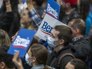 Supporters wear medical masks, as fears of coronavirus increase in California, during a campaign rally for Presidential candidate Sen. Bernie Sanders at the Los Angeles Convention Center on March 1, 2020 in Los Angeles, California. AFP/File