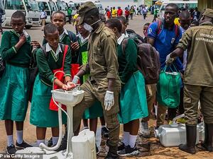 Secondary school students at a temporary hand-washing point, before they return home. The Rwandan Government has decided to send back all students of boarding schools after the first case of COVID-19 was found on March 13, in Kigali. (AFP/File)