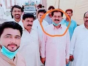Pakistan has suspended six civil servants after they posed for a selfie with a coronavirus patient (circled) in a quarantine centre, an official said today (Dailymail)