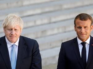 French President Emmanuel Macron and Britain's Prime Minister Boris Johnson speak to the press. (Geoffroy Van der Hasselt/AFP via Getty Images)