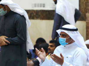 Worshippers wearing protective masks perform at a mosque in Kuwait City on February 28, 2020. (AFP)