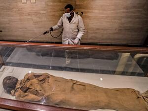 A worker disinfects the Royal Mummies Hall at the Egyptian Museum in Cairo's landmark Tahrir Square amid the coronavirus COVID-19 pandemic, on March 23, 2020. Khaled DESOUKI / AFP