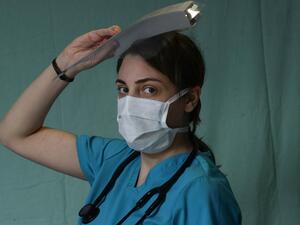 Sarah Eid, a 27-year-old internal medicine resident physician treating COVID-19 coronavirus patients, poses for a picture at Saint George Hospital University Medical Centre in the eastern Ashrafieh district of the Lebanese capital Beirut on April 2, 2020. JOSEPH EID / AFP