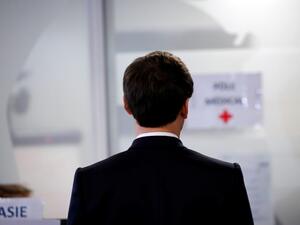 French President Emmanuel Macron visits the Crisis and Support Center at the French Foreign Affairs ministry, at Quai D’Orsay, in Paris, in order to give support and repatriation to French citizens abroad, on April 3, 2020. Francois Mori / POOL / AFP