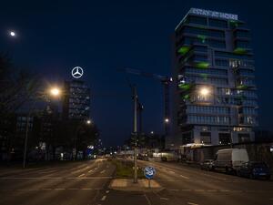An electronic display board on top of a residential building overlooking the river Spree reads: "#stay at home" on April 6, 2020 in Berlin, amid a new coronavirus Covid-19 pandemic. John MACDOUGALL / AFP / POOL