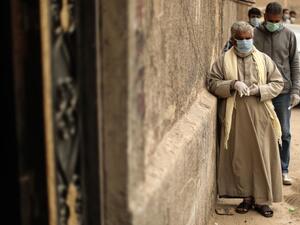 Egyptian men wearing masks wait outside a centre of non-governmental organisation Egyptian Food Bank to receive cartons with foodstuffs on April 05, 2020, as the charity distributes aid to people who lost their jobs due to the coronavirus pandemic crisis, in the Egyptian capital Cairo. The large Cairo-based charity organisation EFB has been at the forefront of a public relief effort in the most populous Arab country, where one third of the population of over 100 million lives in poverty, surviving on about $1.50 or less a day. virus. Egypt so far has recorded 85 deaths out of 1,322 confirmed cases of the COVID-19 illness.  Mohamed el-Shahed / AFP Egyptian men wearing masks wait outside a centre of non-governmental organisation Egyptian Food Bank to receive cartons with foodstuffs on April 05, 2020, as the charity distributes aid to people who lost their jobs due to the coronavirus pandemic crisis, in the Egyptian capital Cairo. The large Cairo-based charity organisation EFB has been at the forefront of a public relief effort in the most populous Arab country, where one third of the population of over 100 million lives in poverty, surviving on about