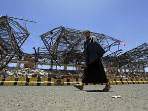 A man walks past a popular public square, which was destroyed late 2017 in an airstrike by the Saudi-led coalition, in the capital Sanaa on April 9, 2020. The Saudi-led coalition began a unilateral ceasefire in Yemen's long war, saying it hoped the initiative to prevent coronavirus in the impoverished country would lead to a wider political solution.  MOHAMMED HUWAIS / AFP