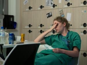 Mathilde Dumont, a 27-year-old nurse, reacts to tiredness early on April 11, 2020, during her night shift in the intensive care unit exclusively for COVID-19 patients at the Ixelles Hospital in Brussels, amid the COVID-19 pandemic, caused by the novel coronavirus. Aris Oikonomou / AFP