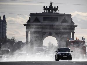Municipal vehicles clean and disinfect a street in downtown Moscow on April 23, 2020, during the COVID-19 outbreak, caused by the novel coronavirus. Alexander NEMENOV / AFP