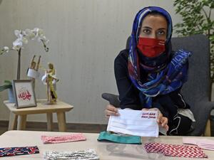 Bahraini entrepreneur Noor Khamdan displays protective masks designed by her at a workshop in Abu Saiba village in the northern part of Bahrain, west of the capital city Manama, amid the COVID-19 pandemic on April 25, 2020. Mazen Mahdi / AFP