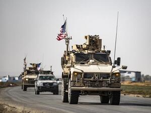 US military vehicles drive on a road after US forces pulled out of their Tal Tamr base in Northern Syrian on October 20, 2019 (PHOTO / SOULEIMAN / AFP)