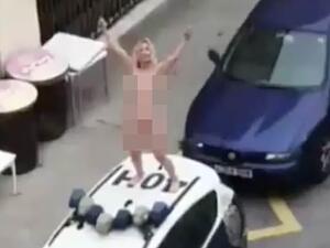 Woman strips and leaps on top of a police car  (Twitter)