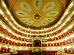 The auditorium of the restored Bolshoi theatre in Moscow, bathed in red Italian fabric and newly gilded mouldings. Photograph: Kirill Kudryavtsev/AFP/Getty Images