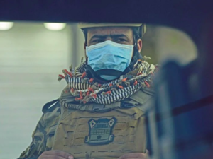 A mask-clad soldier stands guard in Iraq's southern city of Basra, (AFP) 