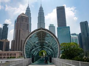 A man wears a facemask, amid fears over the spread of the COVID-19 novel coronavirus, at Saloma Link Bridge in Kuala Lumpur on March 12, 2020. Mohd RASFAN / AFP