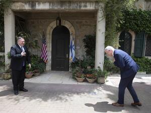 US Secretary of State Mike Pompeo (L), meets with Israeli Blue and White party leader Benny Gantz, in Jerusalem, on May 13, 2020. Pompeo visited Israel for talks with leaders on plans to annex swathes of the occupied West Bank, which has been rocked by two days of deadly violence. The visit by US President Donald Trump's top diplomat comes a day before Netanyahu's unity government with rival-turned ally Benny Gantz was to be sworn in, ending a year of political paralysis.   Sebastian Scheiner / POOL / AFP