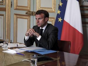 French President Emmanuel Macron listens to German Chancellor during a video conference to discuss a joint plan to spur the EU's recovery from the coronavirus crisis at the Elysee Palace on May 18, 2020, in Paris. (AFP/File)
